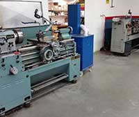 Lathes used to grind the surface of industrial machine parts and tools